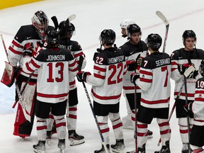 Team Canada celebrates a 5-2 win over Team Latvia during  World Junior Hockey Championship action at Rogers Place in Edmonton on Wednesday, Aug. 10, 2022.