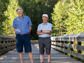 Friends Ben Benjaminy (right) and Dror Goldreich, seen in Edmonton, on Thursday, Aug. 25, 2022. The two men have enjoyed a brisk, six-kilometre walk along trails near their west-end homes nearly every morning for the past 20 years.