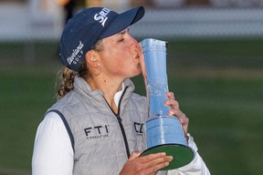 South Africa's Ashleigh Buhai kisses the trophy after her playoff win over South Korea's Chun In-gee on day 4 of the 2022 Women's British Open Golf Championship at Muirfield golf course in Gullane, Scotland, on August 7, 2022.