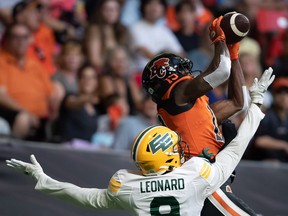 B.C. Lions receiver Dominique Rhymes makes a reception in the end zone as Edmonton Elks cornerback Raphael Leonard defends in Vancouver on Saturday, August 6, 2022.