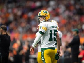 Edmonton Elks quarterback Taylor Cornelius walks to the sideline during the second half of a CFL football game against the B.C. Lions in Vancouver on Saturday, Aug. 6, 2022.