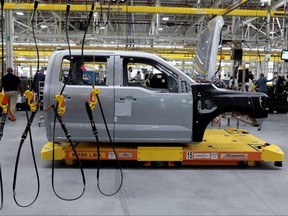 The cab to a Ford all-electric F-150 Lightning truck prototype is seen on an automated guided vehicle (AGV) at the Rouge Electric Vehicle Center in Dearborn, Mich., Sept. 16, 2021.