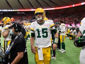 Edmonton Elks quarterback Taylor Cornelius (15) watches from the sideline during the second half of a CFL football game against the B.C. Lions in Vancouver, on Friday, November 19, 2021.