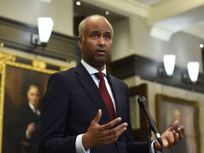Minister of Housing and Diversity and Inclusion Ahmed Hussen speaks during a news conference in the foyer of the House of Commons in Ottawa, June 6, 2022. He cut $133,000 in government funding to the Community Media Advocacy Centre last week and suspended an anti-racism project it was overseeing after "reprehensible and vile" tweets posted by its senior consultant, Laith Marouf, came to light.