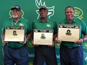 The Canadian Football League's Edmonton Elks football organization added former players Joe Hollimon, left, Ed Jones and Jim Germany to their Wall of Honour at Commonwealth Stadium in Edmonton on Friday Aug. 12, 2022.
