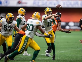 Edmonton Elks quarterback Taylor Cornelius passes during the second half of a CFL football game against the B.C. Lions in Vancouver on Aug. 6, 2022.