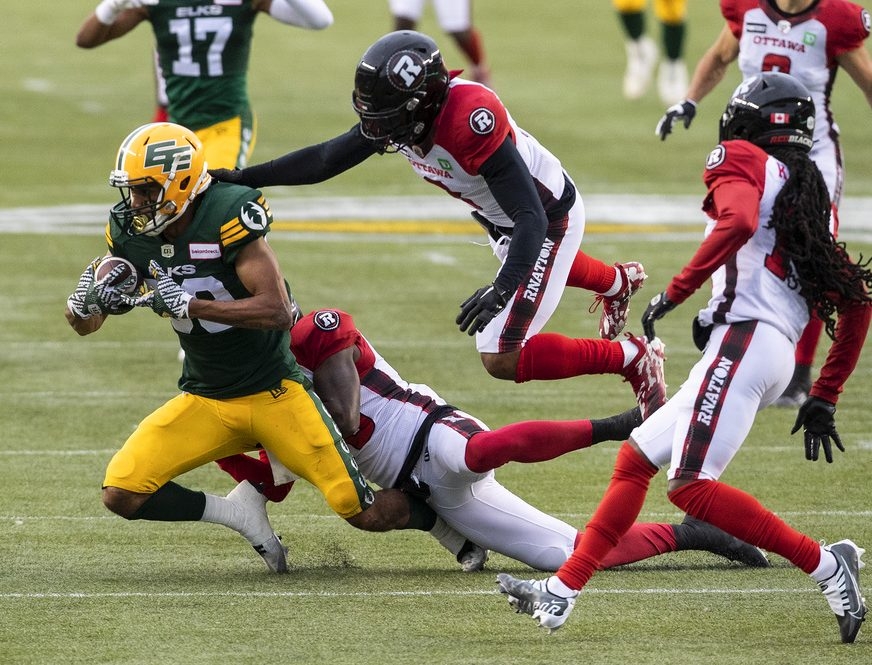 June 15, 2023: Ottawa Redblacks quarterback Nick Arbuckle (9) runs to  escape the rush during the CFL game between Calgary Stampeders and Ottawa  Redblacks held at TD Place Stadium in Ottawa, Canada.