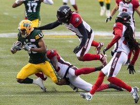 Ottawa Redblacks Patrick Levels (3) tackles Edmonton Elks Kenny Lawler (89) during first half CFL action in Edmonton, Alta., on Saturday August 27, 2022.