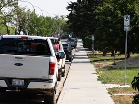 A City of Edmonton parking regulation sign is seen along University Avenue in the Belgravia neighbourhood of Edmonton on Tuesday, Aug. 23, 2022. City council is reviewing parking rules going forward.