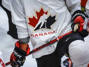 A Hockey Canada logo is shown on the jersey of a player with Canada's National Junior Team during a training camp practice in Calgary, Tuesday, Aug. 2, 2022.THE CANADIAN PRESS/Jeff McIntosh