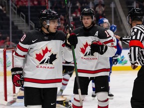 Team Canada's Logan Stankoven (10) celebrates a goal with teammates  during World Junior Hockey Championship action at Rogers Place in Edmonton, on Thursday, Aug. 11, 2022.