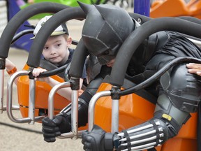 Liam Williams, 5 chats with Batman before the ride begins at K-Days. Monday Morning Magic at K-Days hosted up to 500 special needs children under the age of 13 with many special guests from the Edmonton Elks, firefighters, police officers and super heroes on July 25, 2022.