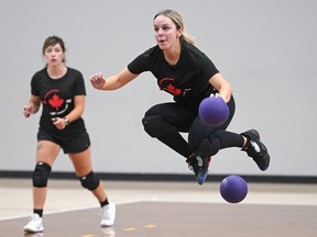Team Canada's Shauna Roe of Toronto, front, leaps to evade a ball during team practice on Tuesday, Aug. 30, 2022, in preparation for the 2022 World Dodgeball Championships which starts Aug. 31, 2022, at the Saville Community Sports Centre in Edmonton. This event will be the largest competition in the history of the sport.