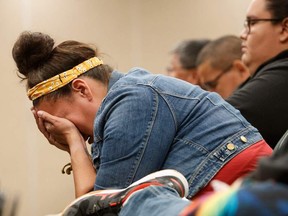 Carlea Stonestand, relative of James Smith Cree Nation stabbing victim Bonnie Burns, fights back tears during a news conference in Saskatoon on Sept. 7, 2022, about the stabbing spree involving Myles and Damien Sanderson in which 11 were killed and 18 injured.