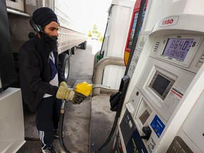 Jatinder Bal fills his semi-truck with over 500 litres of diesel at an Esso Station on 32nd Street N.E. before a trip to Utah on Thursday, September 22, 2022. Relaxed oil prices have prompted the Alberta government to partly reinstate the provincial fuel tax, starting Oct. 1.
