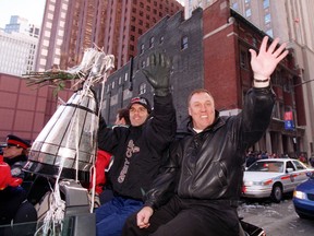Toronto Argonauts coach Don Matthews waves to the crowd during the Grey Cup parade at City Hall in this file photo.