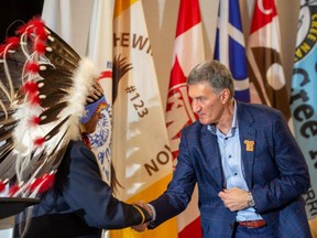 Greg Desjarlais, chief of Frog Lake First Nation (left) and Enbridge CEO Al Monaco at an announcement of a $1.12-billion Indigenous energy investment in northern Alberta Wednesday, Sept. 28, 2022 in Edmonton.