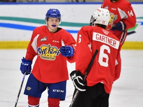 Edmonton Oil Kings forward Gavin Hodnett celebrates a goal at training camp with teammate Caleb Gartner at the Downtown Community Arena on Sept. 4, 2022.