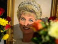 Messages and photographs of Princess Diana are seen on the gate as fans of the Royal Family gather outside Kensington Palace to show their support on the 25th anniversary of the death of Diana, Princess of Wales, in London, England, Wednesday, Aug. 31, 2022.