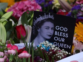 Cards and flowers are laid out following the passing of Queen Elizabeth in Balmoral, Scotland, on Sept. 10, 2022.