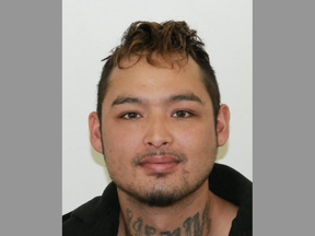RCMP are still searching for Brenon Gray, who is wanted for first-degree murder in connection with the death of 35-year-old Romeo Flett.