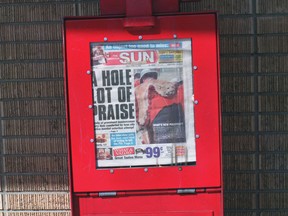 Shot of Sun box with Edmonton Sun newspaper inside.
