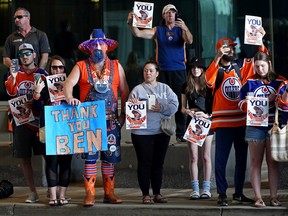 Hockey fans pay their respects at a farewell funeral procession for Ben Stelter, the six-year-old Edmonton Oilers hockey fan who was befriended by the team, was held outside Rogers Place on Friday, Aug. 19, 2022.