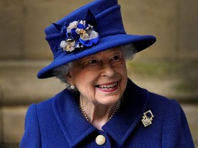 Britain's Queen Elizabeth leaves after a Service of Thanksgiving to mark the Centenary of the Royal British Legion at Westminster Abbey, London, on Oct. 12, 2021.