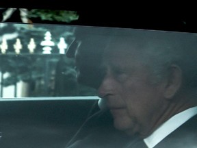 King Charles III is driven away from Balmoral Castle in Ballater, on Sept. 9, 2022, a day after Queen Elizabeth II died at the age of 96.