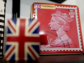 A shortbread biscuit tin with the Queen's image is visible on display at Churchill's British Imports, 8116 Gateway Blvd., Saturday Sept. 10, 2022.