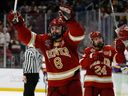 Denver forward Carter Savoie (8) celebrates a goal against Minnesota State during the third period of the 2022 Frozen Four College ice hockey championship game at TD Garden on April 9, 2022. 