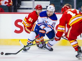 Edmonton Oilers defenceman Ryan Murray (28) controls the puck against the Calgary Flames during the third period at Scotiabank Saddledome. Sergei Belski-USA TODAY Sports