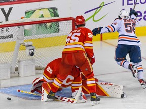 Edmonton Oilers Kailer Yamamoto celebrates a goal against Calgary Flames goalkeeper Jacob Markstrom during the third period of the first game of the second round of playoff action at Scotiabank Saddledome on May 18, 2022. Flames won 9-6.