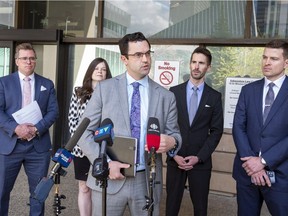 Alberta Crown Attorney's President Dallas Sopko speaks at a news conference outside the Edmonton law courts building where he gives an update regarding labour discussions with the province on Monday, May 2, 2022 in Edmonton . Behind him are crown attorneys Matt Dalidowitz, Breena Smith, John Schmidt and Aaron Rankin. Greg Southam-Postmedia