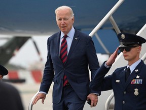 U.S. President Joe Biden disembarks from Air Force One upon arrival at Los Angeles International Airport in California, Wednesday, Oct. 12, 2022.