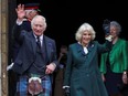 King Charles and Queen Camilla wave at an official ceremony to mark Dunfermline as a city, in Dunfermline, Scotland, Britain, Monday, Oct. 3, 2022.