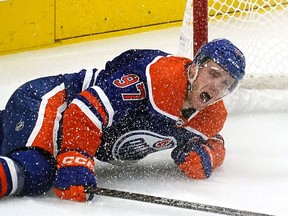 Edmonton Oilers captain Connor McDavid crashes into the goal post during second period National Hockey League game action against the Pittsburgh Penguins in Edmonton on Monday, October 24, 2022.