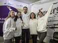 Staff members of the Centre for Civil Liberty pose for a photo and celebrate in their office after receiving the 2022 Nobel Peace Prize, along with human rights advocate Ales Bialiatski from Belarus, and the Russian human rights organization Memorial, on Friday, Oct. 7, 2022 in Kyiv, Ukraine.