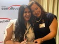 Michelle Eaton, of the Canadian Taxpayers Federation, presents Toronto Sun Editor-in-Chief Adrienne Batra with the TaxFighter Award on Thursday, Oct. 20, 2022.