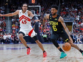 Nickel Alexander-walker (6) dribbles the ball around Toronto Raptors forward Dalano Banton (45) during the fourth quarter NBA exhibition game at Rogers Place on Oct. 2, 2022.