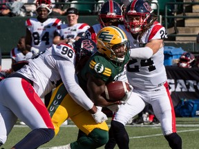 October 1, 2022  Kevin Brown (4) is tackled by Michael Wakefield (96) as the Edmonton Elks and the Montreal Alouttes play at Commonwealth stadium in Edmonton.
BRUCE EDWARDS/Edmonton Journal