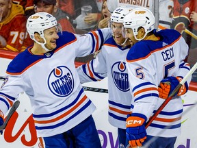 Edmonton Oilers Connor McDavid celebrates with teammates after scoring against the Calgary Flames in NHL hockey at the Scotiabank Saddledome in Calgary on Saturday, October 29, 2022.