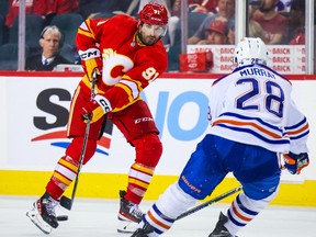 Calgary Flames' Nazem Kadri (91) passes the puck against the Edmonton Oilers during the third period at Scotiabank Saddledome.