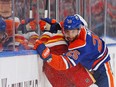 Sep 30, 2022; Edmonton, Alberta, CAN; Edmonton Oilers defensemen Darnell Nurse (25) checks Calgary Flames forward Tyler Toffoli (73) during the second period at Rogers Place.