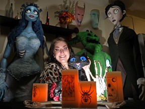 Caitlin Carmichael, a professional makeup effects artist, with some of her creations at her house of horror in Edmonton.