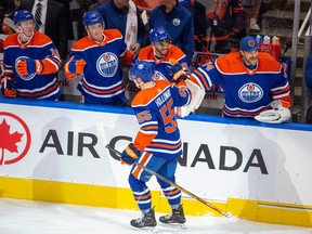 Edmonton Oilers Dylan Holloway (55) celebrates his goal against the Vancouver Canucks during first period pre-season action on Monday, Oct. 3, 2022, in Edmonton.