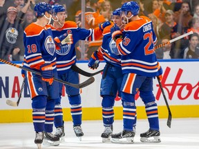 Edmonton Oilers Tyson Barrie (22) celebrates his goal with teammates Zach Hyman (18), Connor McDavid (97) and Leon Draisaitl (29) against the Seattle Kraken during first period preseason action on Friday, Oct. 7, 2022 in Edmonton.