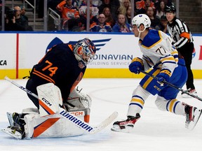 Buffalo Sabres' John-Jason Peterka (77) scores on the Edmonton Oilers' goalie Stuart Skinner (74) during second period NHL action at Rogers Place in Edmonton, Tuesday Oct. 18, 2022.