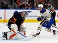 Buffalo Sabres' John-Jason Peterka (77) scores on the Edmonton Oilers' goalie Stuart Skinner (74) during second period NHL action at Rogers Place in Edmonton, Tuesday Oct. 18, 2022.