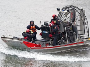 An airboat from Strathcona County Emergency Services staffed by firefighter/paramedics sweeps the North Saskatchewan River. Police and peace officers searched the banks of the North Saskatchewan River in Edmonton for human remains on Wednesday, Oct. 5, 2022.